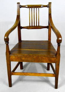 American Sheraton Style Oak Armchair: with turned crestrail and five wood splats the plank seat flanked by a pair of shaped arms the whole raised on four tapering square legs supported by stretchers. NOTE: One loose arm, paint on rear