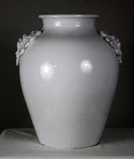 White Pottery Urn: With north wind medallions. 18 x 14 D in. Marked on base "Pugi-Italy"