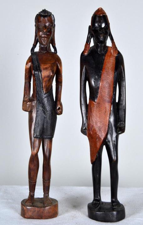 Two Figures of Maasai Warriors: Modern, each standing with holes in hands for spears (missing). Each: 18.5 x 3.5 in. Condition: Wear consistent with age and use Property of Anthony French. Sr.