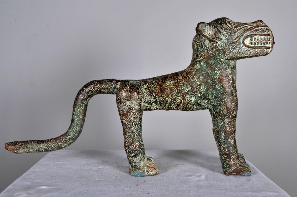 Benin Bronze of Spotted Leopard: Edo peoples, Nigeria, African, bronze; female spotted leopard, with tail down, good patina on legs and body. 14 x 24 x 4 in. Condition: Wear consistent with age and use Property of Anthony French. Sr.