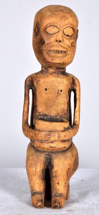 Dogon Figure of Seated Woman: West Africa, Mali, Wood; Of a seated woman with a basket in her lap. 12 x 2.5 x 3 in. Condition: Wear consistent with age and use Property of Anthony French. Sr.