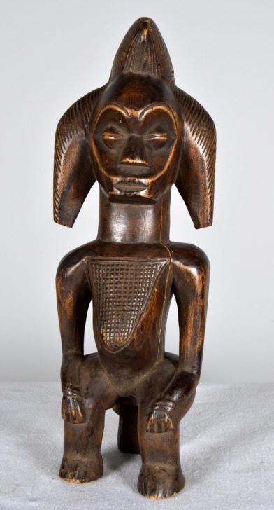 Fang Reliquary Figure: African, Gabon, 20th Century, wood; of a seated figure with carved chest and hair. 15 x 5 x 4 in. Condition: Wear consistent with age and use Property of Anthony French. Sr.