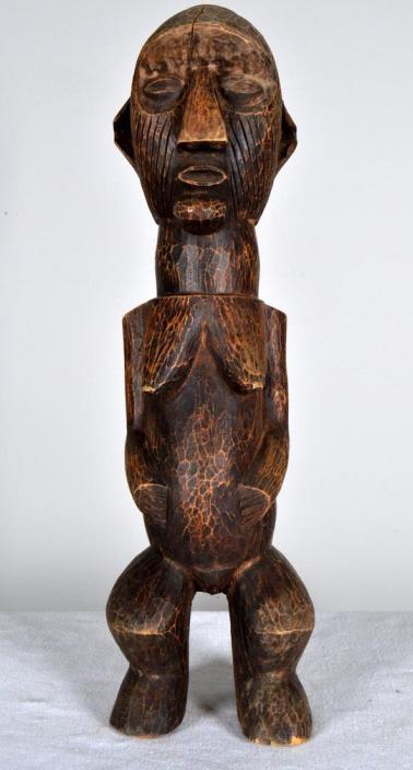 Igbo Fertility Figure: African, Nigeria, wood, 20th Century; Of a woman with a baby on her back. 21 x 6 x 4 in. Condition: Wear consistent with age and use Property of Anthony French. Sr.