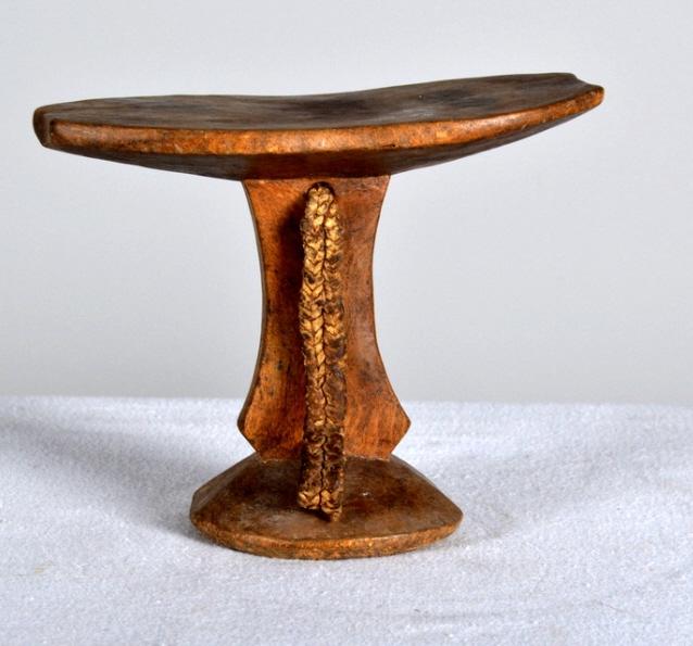 Mursi Headrest: African, Ethiopia, 20th Century, wood; Of usual form with a braided handle 6 x 7.5 x 3.75 in. Condition: Wear consistent with age and use Property of Anthony French. Sr.