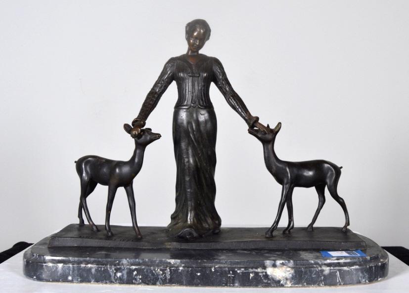 After DH Chiparus (French, 1886-1947): Woman with Two Deer Bronze on marble base Signed and dated "1921" 13 x 20.5 x 10 in. Condition: Chips to marble base. Property of Anthony French. Sr.