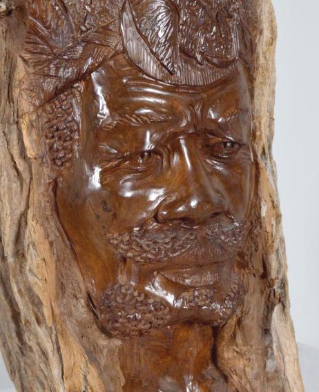 African Ironwood Tree Sculpture: With bark intact, the face of a man carved into a natural opening in the wood. Possibly by David Mudede (Zimbabwean, 20th Century) 26 x 8 x 7 in. Condition: No apparent flaws Property of Anthony Frenc