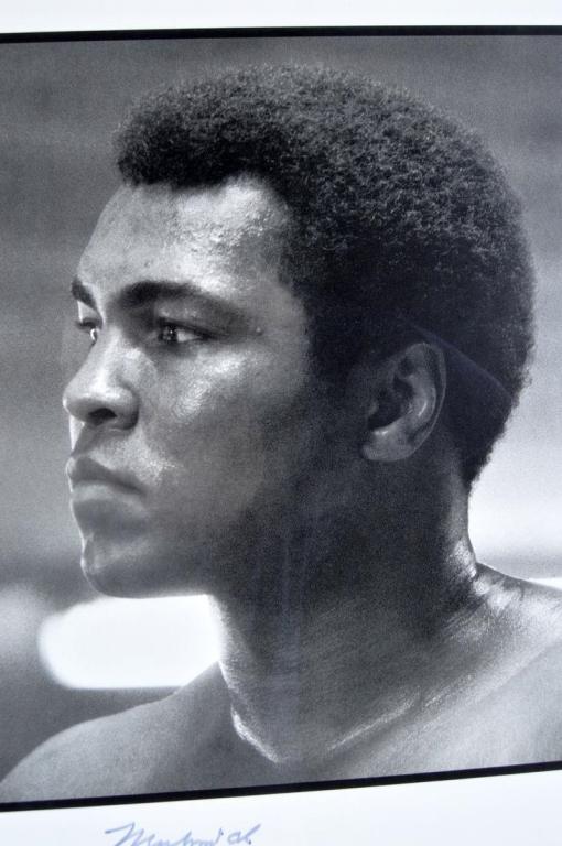 Muhammad Ali Center - Ali Autographed Print: Muhammad Ali Center - Opening, 2004 Lithograph Black and white photograph of Muhammad Ali to commemorate the opening of the Muhammad Ali Center in Louisville, KY. Signed in pen by Ali Image: 22 x 16 i