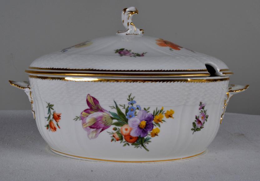 Royal Copenhagen Saxon Flower, Lidded Tureen: This porcelain tureen has flowers though-out and on white porcelain ground and gold leaf on the edges 7.75 in. D x 12 in. x 7 in. Markings on the bottom Excellent condition