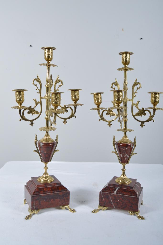 Four Light Garniture Set: Each with four lights on brass arms emanating from a central ochre-colored urn over a stepped matching marble base, the whole raised on brass feet. 18.5 x 8 x 4 in. NOTE: Good Condition