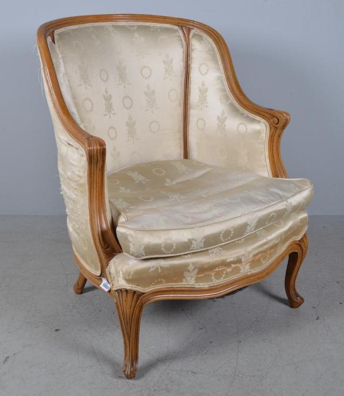 Louis XV Bergere: Silk fabric with carved, rolled arms on scroll feet. Circa late 19th C. 38 x 29 x 30 in. Good Condition.