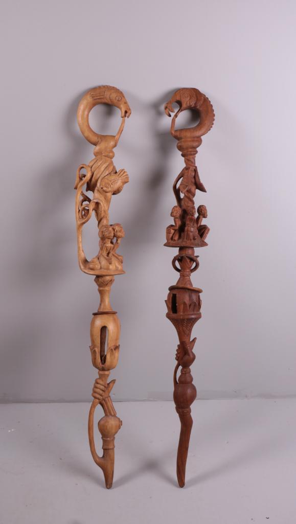 Pair of Nyami-Nyami Walking Sticks: River God staff, or scepter. Dimensions: 41 x 3 x 3 in. NOTE: Repairs apparent. Property of Anthony French Jr.
