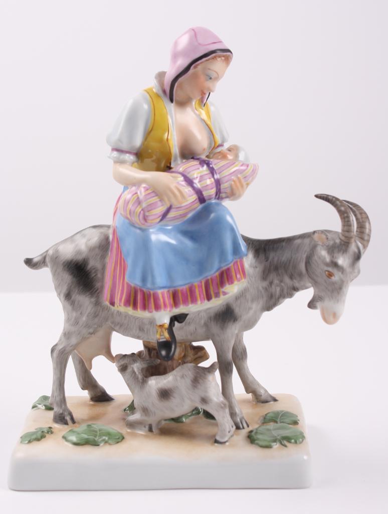 Herend Figurine - Woman on a Goat Breastfeeding: Hand Painted Signed with Herend marks: 5708-0-00 G91 (July '91) Dimensions Approximately: 8.5 x 7 x 3 in. NOTE: No apparent flaws