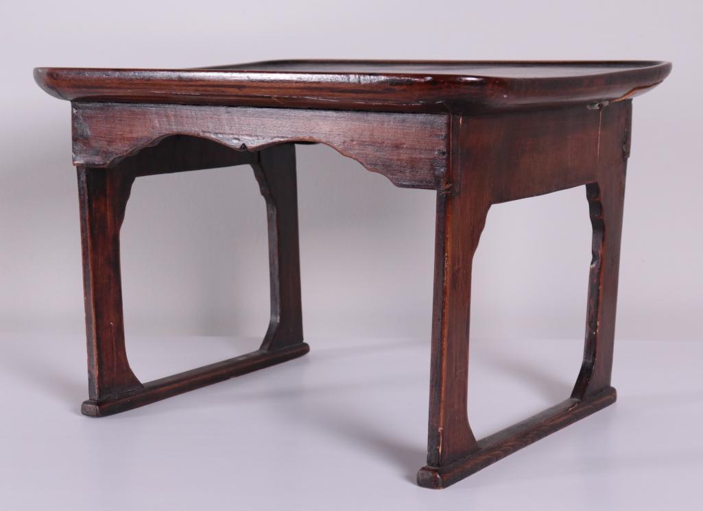 Chinese Huanghuali Lap Desk: With a moulded top. Dimensions: 9.5 x 14 x 11 in. NOTE: Wear consistent with age and use