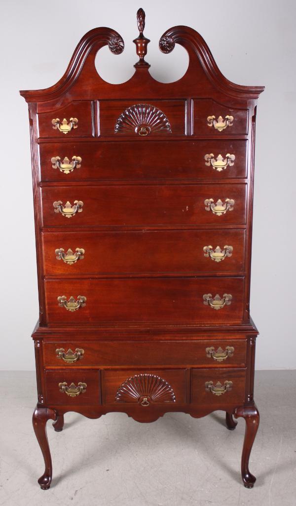Queen Anne Style Chest on Stand: Mahogany highboy form, broken arch pediment with three drawers over four full drawers and batwing pulls. Upper and lower center drawers have carved shell. One piece construction. By Arlington. Dimensi