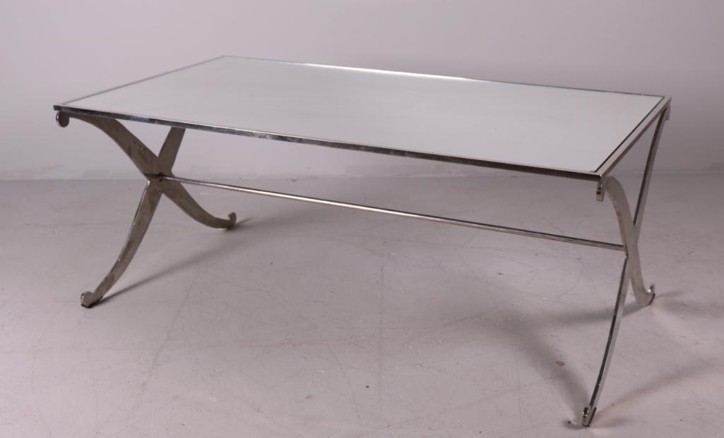 Mirrored Coffee Table: Gold trim coffee table with gold trim X leg base. Dimensions: 18 x 44 x 24 in. NOTE: Good Condition, chip to one corner of top