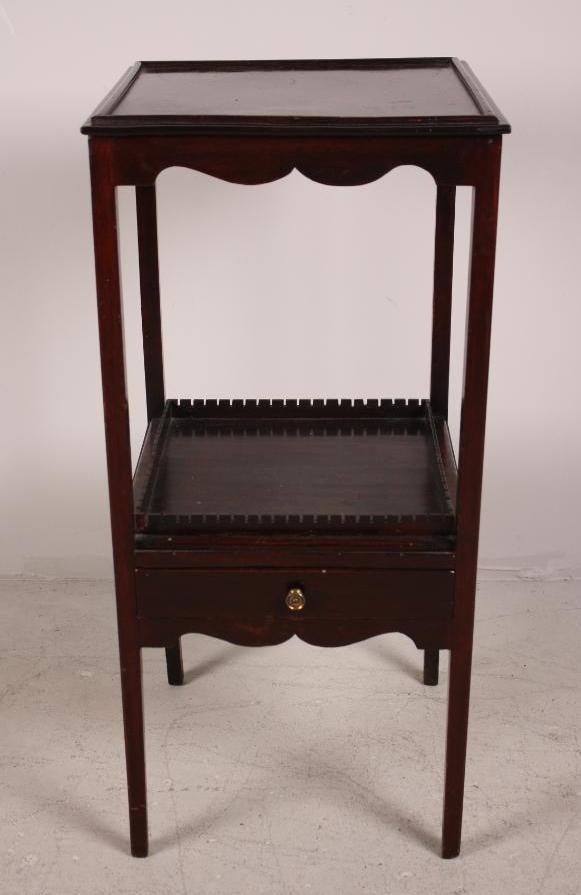 George III Tiered Side Table: Mahogany, with an upper and lower shelf with drawer, on tapered legs. Dimensions: 31 x 14.5 x 14.5 in. NOTE: Wear consistent with age and use