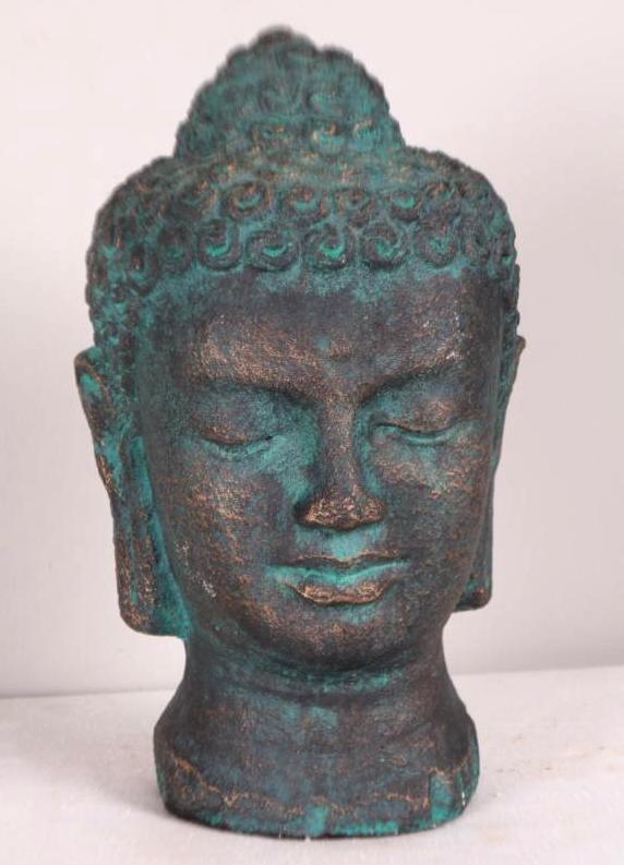 Chalkware Buddha Head: Black with green patina. Dimensions: 11 x 6 x 6 in.