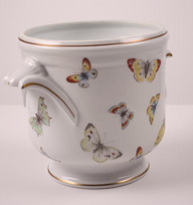 Limoge Cache Pot: Of usual form, decorated with butterflies Dimensions: H 7 x W 9.25 x D 7 inches NOTE: No evidence of repairs, chips or cracks
