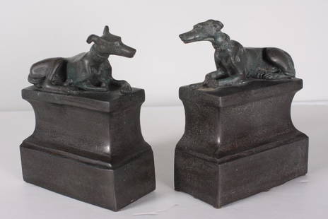 Pair of Greyhound Bookends: Each with a greyhound reclining on a rectangular plinthDimensions: H 7 x W 5.5 x D 2.5 inchesNOTE: Good condition  Property from the Estate of Bill Ford, Paducah, KY