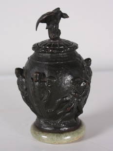 19th C. French Bronze Urn: Patinated miniature lidded urn with Eagle lid and soldier relief throughout. On a green marble base. Dimensions: H 6 x W 3.5 x D 3.5 inches NOTE: Good overall Property from the Estate of Bill