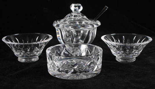 A Collection of Crystal Items: Including a Waterford Wine Bottle Coaster, a Baccarat Mustard Pot and two unmarked dishes, measurements for Mustard Pot. Dimensions: H 5.5 x W 5 x D 5 inches NOTE: No apparent flaws