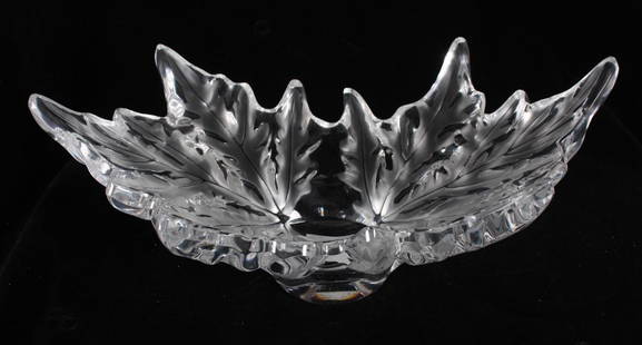 Lalique Leaf Bowl: Flared leaf pattern resting on round circular base, marked on base  Dimensions: H 7 x W 18 x D 10 inches  NOTE: No apparent flaws