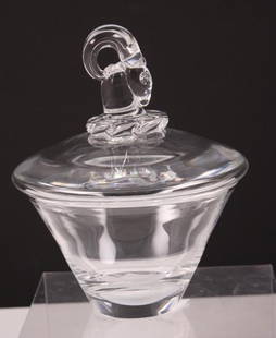 Steuben Crystal Lidded Cache Pot: Of tapered form, the lid with a ram's head, marked Steuben Dimensions: H 7 x W 5.5 x D 5.5 inches NOTE: No evidence of repairs, chips or cracks