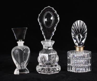 Two Glass Perfume Bottles: Each unmarked, measurements for the larger Dimensions: H 7.5 x W 3 x D 3 inches NOTE: No apparent flaws