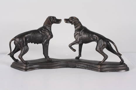 Cast Iron Sculpture of Two Hunting Dogs: Two dogs, one male, one female face each other Dimensions: H 9 x W 20 x D 4 inches NOTE: Good condition Property from the Estate of Bill Ford, Paducah, KY