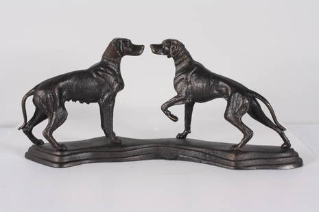 Cast Iron Sculpture of Two Hunting Dogs: Two dogs, one male, one female face each otherDimensions: H 9 x W 20 x D 4 inchesNOTE: Good condition Property from the Estate of Bill Ford, Paducah, KY