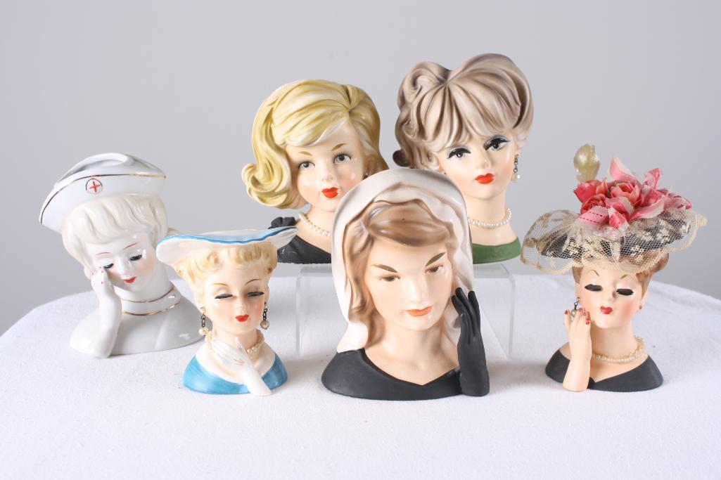 A Grouping of Six Female Form Vases: With various markings, including a Jackie Kennedy vase. All quite stylish in their own way, measurements for largest. Dimensions: H 6 x W 4 x D 3.5 inches NOTE: No evidence of cracks, chips or repairs