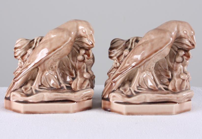 Pair of Rookwood Pottery Raven Bookends: Each dated 1954 and stamped with William McDonald's Cipher, light brown ground, each marked on base Dimensions: H 5.5 x W 5 x D 3 inches NOTE: No evidence of cracks, chips or repairs