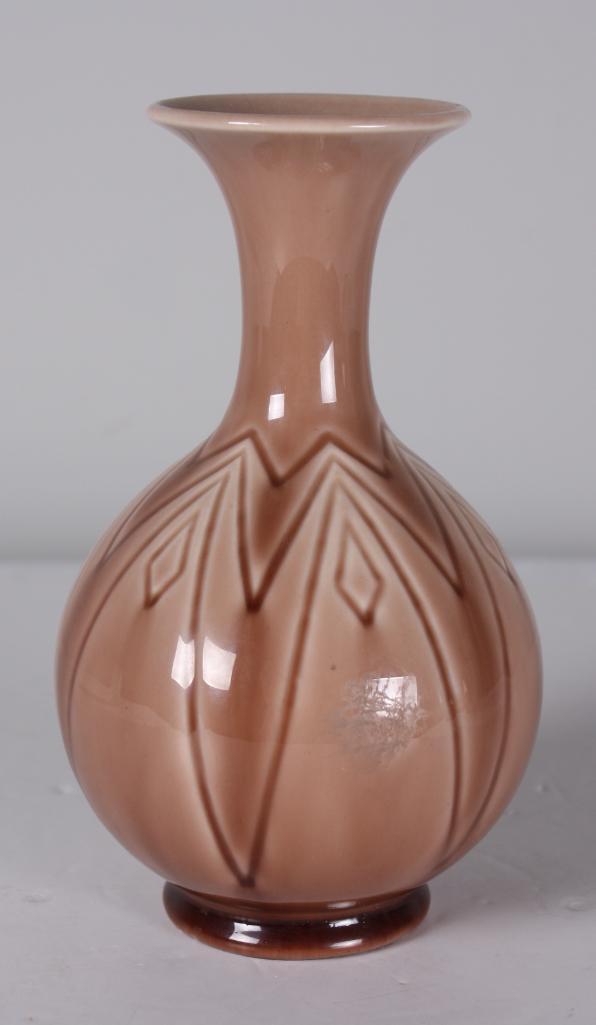 Rookwood Pottery Vase: Geometric lines throughout on dusty rose glazed vase, dated 1956. Stamped and marked on base Dimensions: H 7.25 x W 4 x D 4 inches NOTE: No apparent chips, cracks or repairs