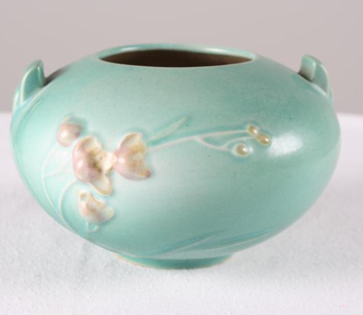 Roseville Pottery Ixia Round Vase: Green ground, marked on base 326-4 Dimensions: H 4 x W 7 x D 7 inches NOTE: No evidence of cracks, chips or repairs