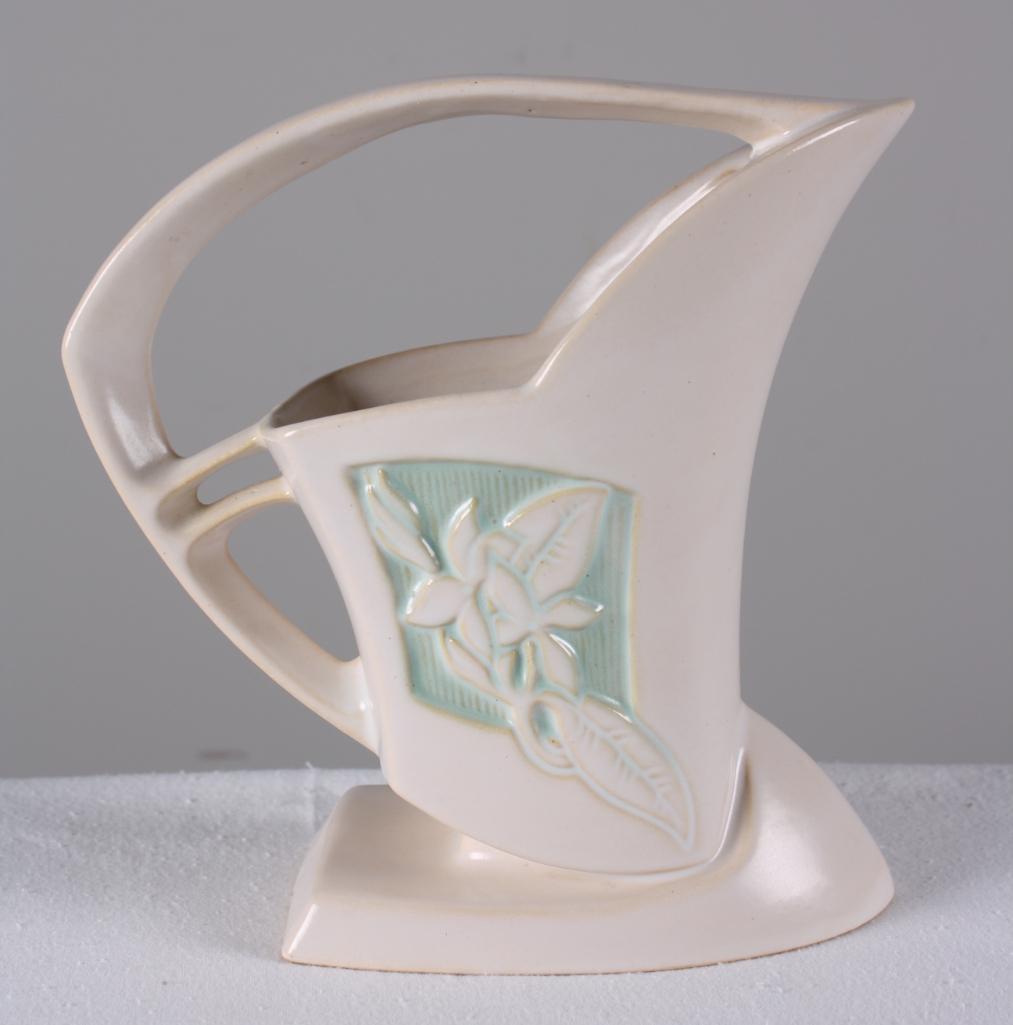 Roseville Pottery Silhouette Handled Vase: White ground, 1952, marked 709-8 on base Dimensions: H 8.5 x W 9 x D 4 inches NOTE: No evidence of cracks, chips or repairs