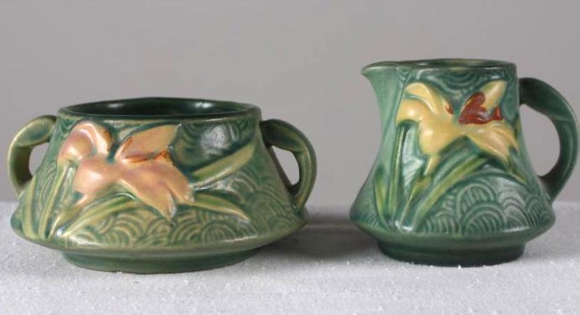 Roseville Pottery Zephyr Lily Creamer and Sugar: Green ground, each marked on base, measurements for sugar. Each marked on base Dimensions: H 2.5 x W 4.75 x D 4.75 inches NOTE: No evidence of cracks, chips or repairs