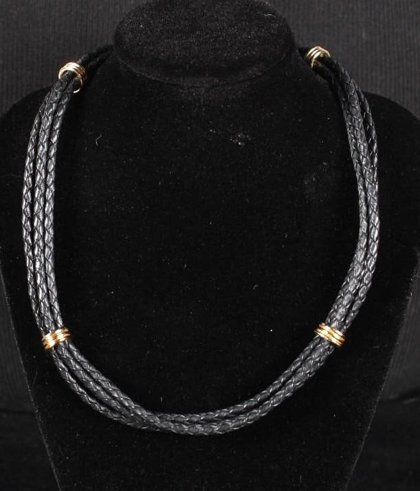 Claire Williams Aspen Necklace: Black braided leather with gold magnetic accents Dimensions: H 16 x W x D inches NOTE: Excellent Condition