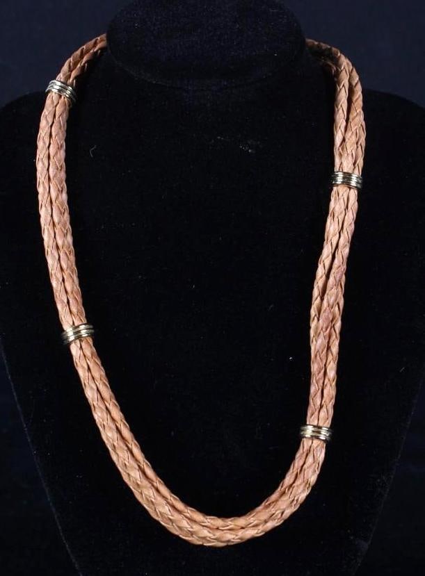 Claire Willams Aspen Necklace: Tan braided leather with gold magnetic accents Dimensions: H 16 x W x D inches NOTE: Excellent Condition