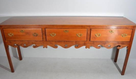 George III Style Sideboard (Hunt Board): With a rectangular top over three drawers over an ogee apron, raised on four square legs.  Dimensions: H 36 x W 81 x D 19 inches  NOTE: Wear consistent with age and use