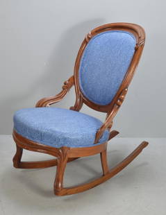 Renaissance Revival Rocking Chair: With a round upholstered back framed by wood, the upholstered seat over a shaped apron, raised on cabriole legs and rockers.Dimensions: H 35.5 x W 21 x D 29 inchesNOTE: Wear consistent with age and us