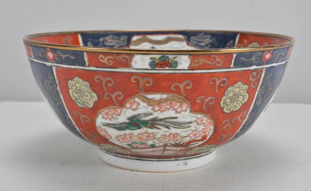 Chinese Bowl: With alternating blue and red ground panels, marked indistinctly on base. Dimensions: H 4.75 x W 10 x D 10 inches NOTE: Wear consistent with age and use