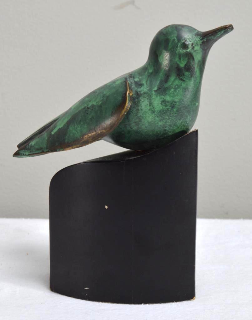 Bronze Patinated Bird Sculpture: Of a bird, on a wooden base. Dimensions: H 6.5 x W 5 x D 4 inches NOTE: Wear consistent with age and use