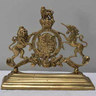 Brass Doorstop: In the form of the Royal Arms of Great Britian  Dimensions: H 9.5 x W 11 x D 3 inches  NOTE: Wear consistent with age and use