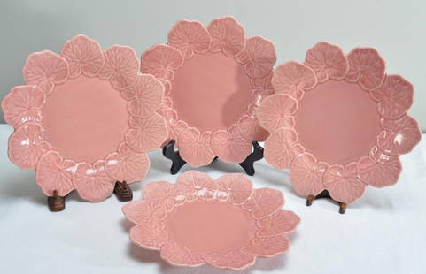 Four (4) Bordallo Pinheiro Majolica Geranium Pink Dinner Plates: Each marked on base. Dimensions: H 1 x W 11 x D 11 inches NOTE: No apparent chips or evidence of repairs.