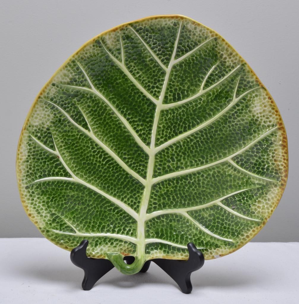 An Italian Majolica Palm Leaf Platter: Marked on base. Dimensions: H 1 x W 14 x D 13.5 inches NOTE: No apparent chips or evidence of repairs.