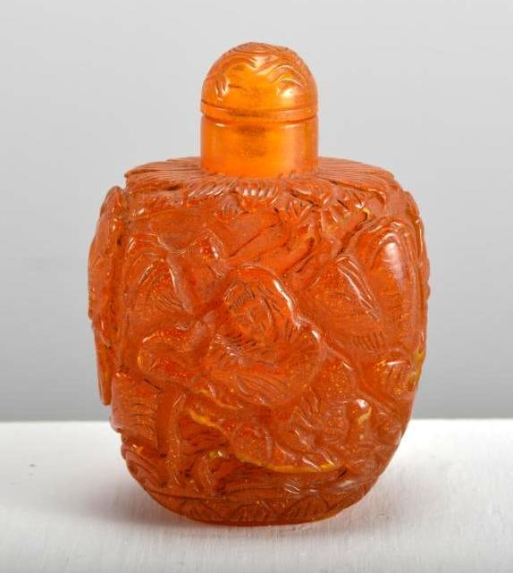 Carved Amber Snuff Bottle: Intricately carved. Dimensions: H 3 x W 2 x D 1 inches NOTE: Good condition given age and use