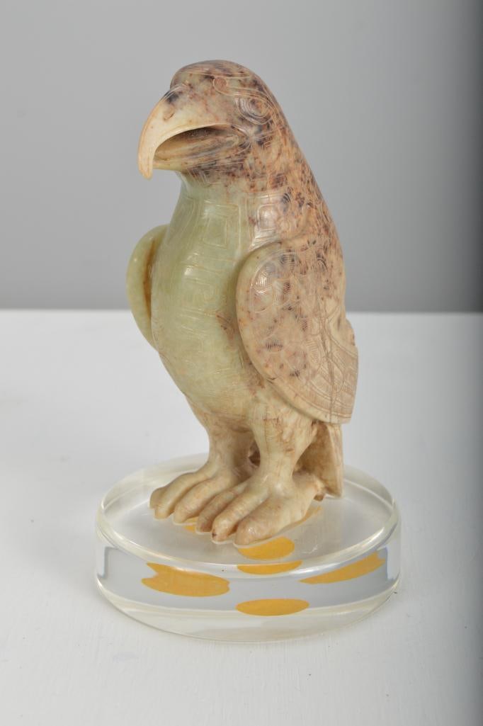 Chinese Carved Hardstone Hawk: With folded wings, on a custom lucite base, with fitted box. Dimensions: H 6 x W 4 x D 4 inches NOTE: Very good condition, no apparent losses