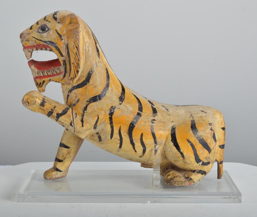 Burmese Polychrome Tiger: Early 20th C., of a tiger in a fierce pose, left paw raised with open mouth, custom lucite base. Dimensions: H 12.5 x W 15 x D 5.5 inches NOTE: Good condition given age and use