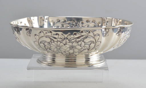 Gorham Sterling Silver Center Bowl: With a lobed body with repousse flowers and foliage. Marked and monogramed on base. Total weight: 287 g Dimensions: H 2.5 x W 8 x D 8 inches NOTE: Wear consistent with age and use