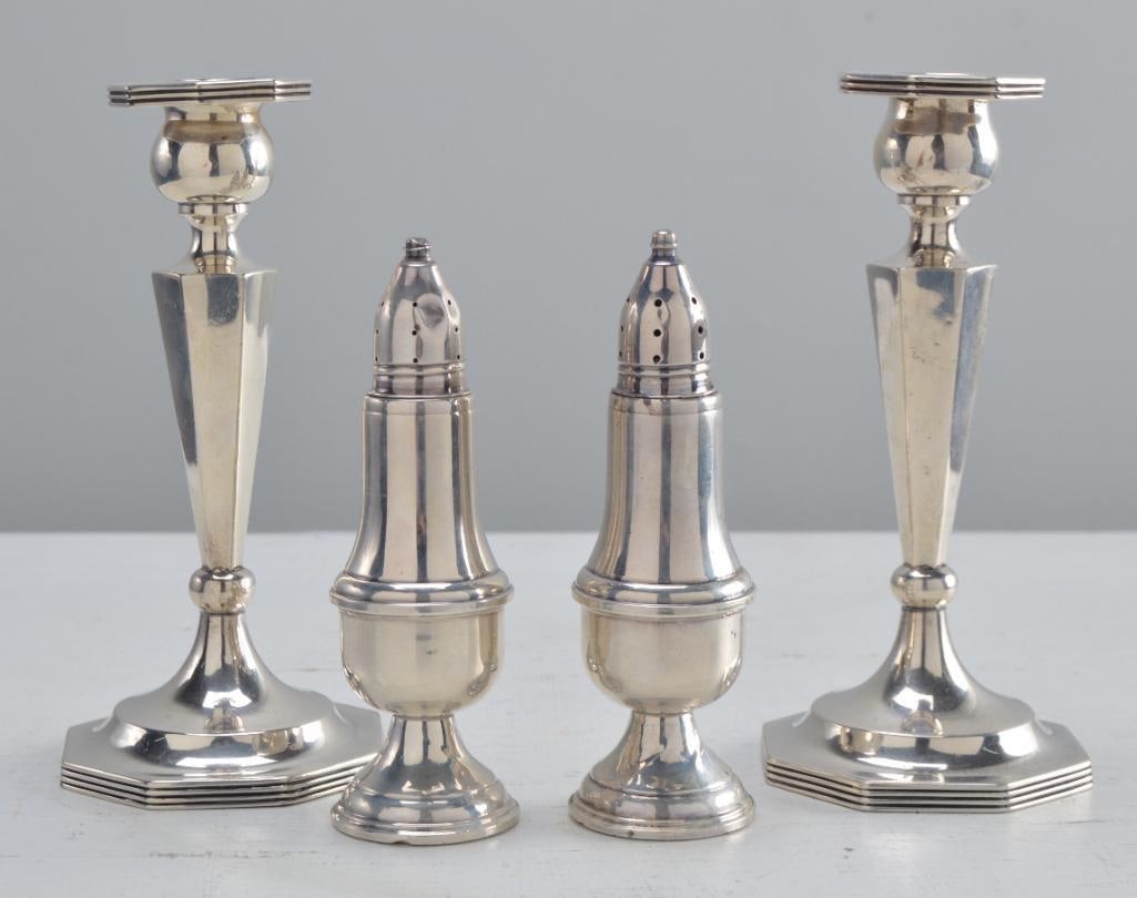 Two Sterling Taper Sticks and Two Sterling Castors: Each weighted. Marked indistinctly. Measurements for taper sticks Dimensions: H 6.5 x W 3 x D 3 inches NOTE: Wear consistent with age and use